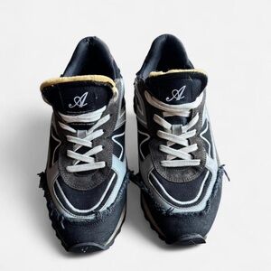 Axel Arigato Black and White Distressed Sneakers